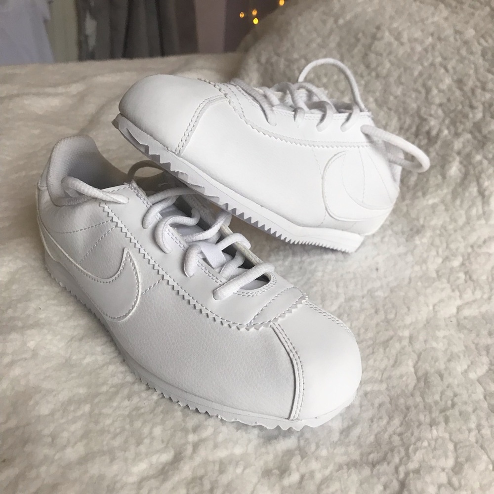 All white Nike Cortez